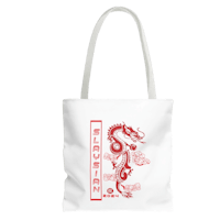a white tote bag with a red dragon on it