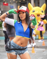 a woman in a pokemon costume posing for a photo