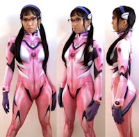 a woman in a pink suit is posing for a photo