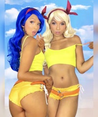 two women in yellow bikinis posing for a photo