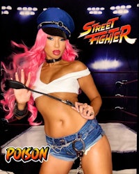 a sexy woman with pink hair is posing for a photo